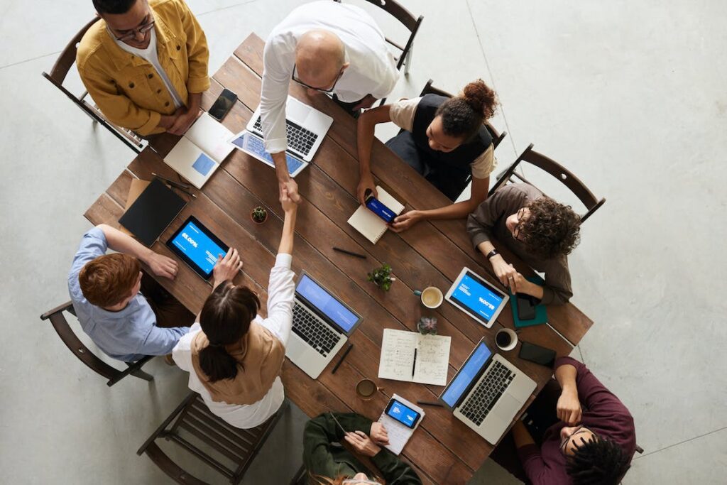 A sales meeting happening around a table.