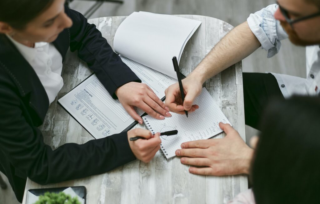 Colleagues reviewing documents together.